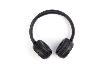 Black wireless headphones on white background.  Advanced acoustic stereo sound system