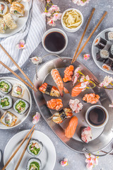 Japanese food. Big sushi set. Assorted set of various sashimi, maki and sushi rolls with different fillings - tuna, sea bass, salmon, shrimp, vegetables. Flatlay copy space