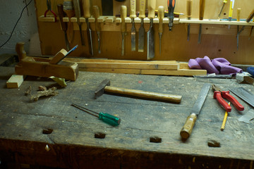 Woodworking tools joiner cabinetmaker workshop tools messy workbench in the basement with tools...