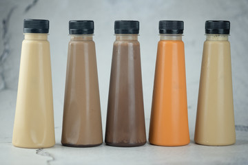 Various refreshing coffee and milk tea drinks in plastic bottle