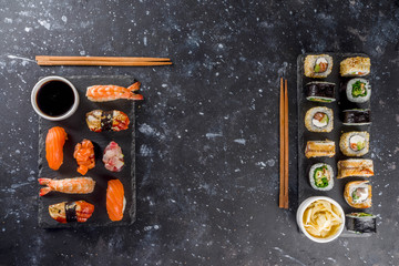 Japanese food. Big sushi set. Assorted set of various sashimi, maki and sushi rolls with different fillings - tuna, sea bass, salmon, shrimp, vegetables. Flatlay copy space