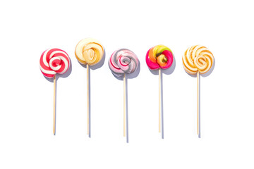 Five sweet lollypops isolated