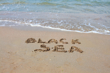 inscription on the sea sand black sea