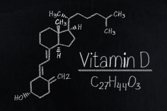 Black chalkboard with the chemical formula of Vitamin D