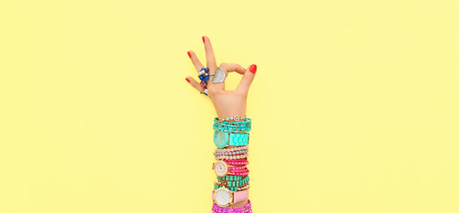 Fashion. Trendy wrist watches, jewelry, female hand, OK gesture, accessories set. Minimal design....
