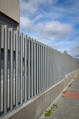 metal pipe fence and gray concrete