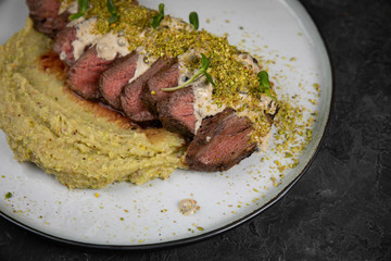 Grilled meat with pure on black background