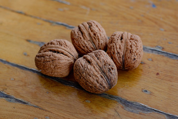 Walnuts on an old wooden table, walnuts useful for the brain