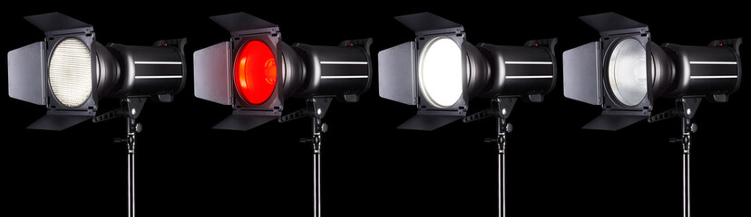 Set of studio flash lights isolated on black background with lamp.