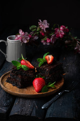 chocolate brownies with strawberries, a dessert, dark wooden backdrop, floral background