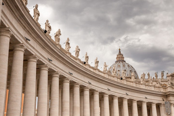 ROME, ITALY - 2014 AUGUST 19. St. Peter's Basilica, Group of statues of Peter's Square Colonnade...