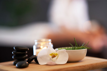 Relaxed woman receiving back massage