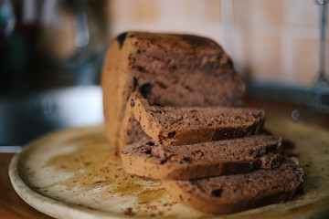 Freshly baked black bread with raisins (Home baking, baking) closeup
