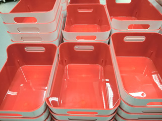 Fototapeta premium Stack of plastic container box storage. Plastic containers for home use stack in a store for sale. Houseware store plastic containers.