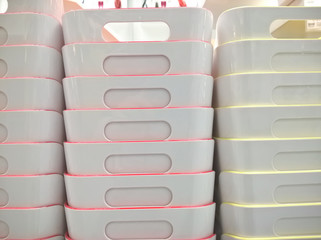 Stack of plastic container box storage. Plastic containers for home use stack in a store for sale....