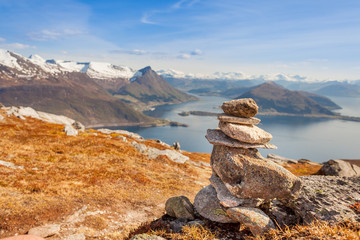 Cairn a pile of stones) marking mountain hiking trail in Norway.