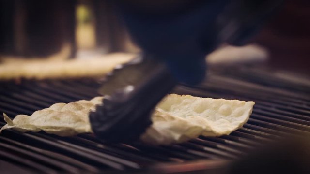 Grilling dried cod on the stove
