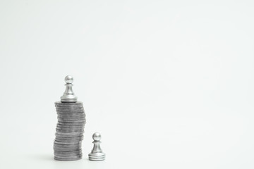 Pawn stand higher on pile of coin. Business competitive and advantage on capital.