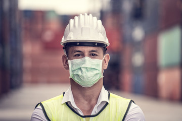 Coronavirus Disease or COVID can spread easily without mask. Quarantined masked workers protect...