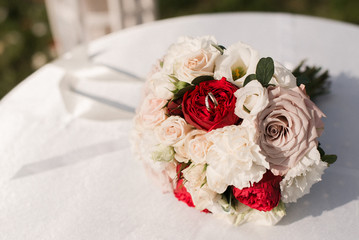 Wedding rings and the bride's bouquet. Wedding rings.