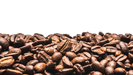 coffee beans roasted on a white background with copy space for your text