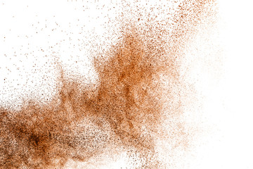 Deep brown powder dust explosion on white background.