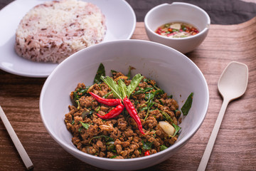 Stir fried minced pork with basil served with steamed jasmin rice and Riceberry, Pad kra pao.