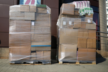 Huge pile of cardboard boxes packed together with stretch tape