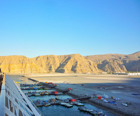 Beautiful desert landscape and scenery with rocky mountains steep cliffs to sea in cruise port of...