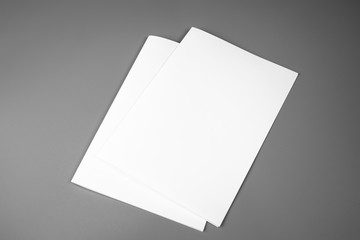 Blank portrait mock-up paper. brochure magazine isolated on gray, changeable background / white paper isolated on gray