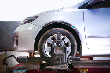 Adjusting the car's undercarriage, circular motion, wheel of fortune and wheel alignment at the service station.