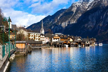 Fototapeta na wymiar Hallstatt - UNESCO Heritage village against mountain and lake in winter. It`s most popular, romance and dream of destination for many tourists. Austria.