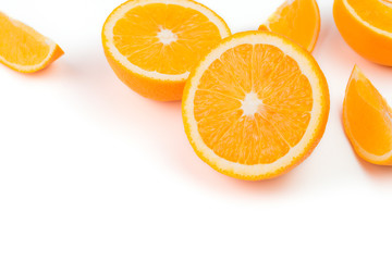 Oranges, sliced ​​in half on a white background. The top view has space for text design.