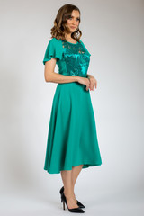 Fototapeta premium beautiful girl posing in green dress