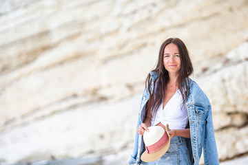 Young beautiful woman on white tropical beach.