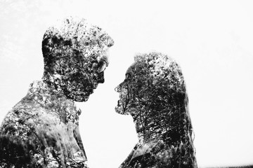 Multiple exposure of man and woman in nature.