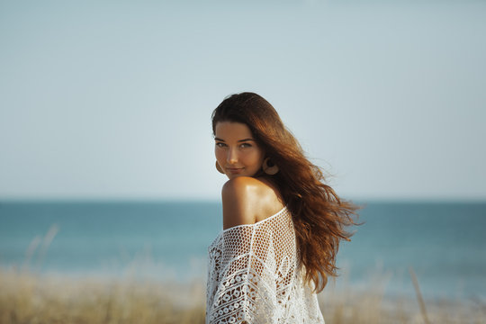 Woman Resting on the Beach During Vacation