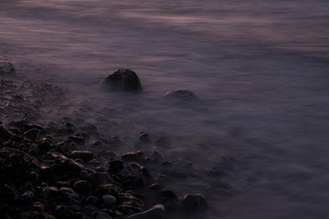 Sea over smooth rocks, time exposure