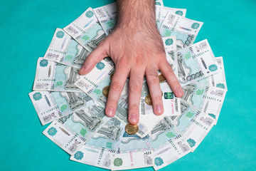 Man holds Russian money. Financial theme. Money in men's hands.