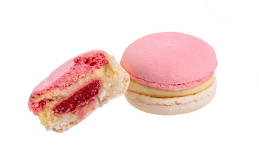 Exclusive pink macaroons eaten isolated on the white