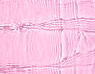 Cosmetic moisturizer water toner pink herbal extract on water background 