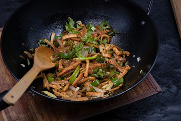 Vegan tofu and pepper stir fry in wok