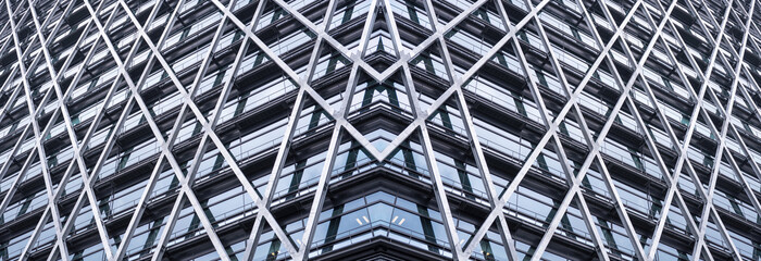 underside panoramic and perspective view to steel blue glass high rise building skyscrapers, business concept of successful industrial architecture