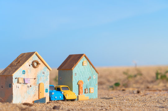 Real estate, lifestyle concept,Miniature house and car on blue sky background