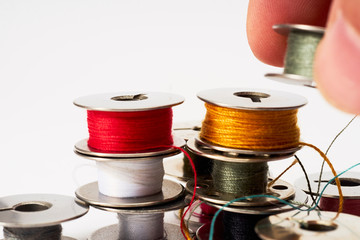                                Industrial Sewing machine bobbins isolated on white background...