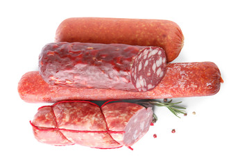 Different types of sausages on white background, top view