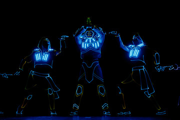 Obraz na płótnie Canvas Neon Glow dancers. Entertainment. Led suits. Egyptian theme.