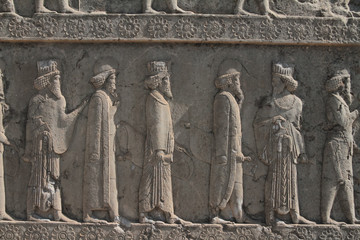 Persepolis Reliefs Detail of Kings and Queens entering the city in Iran