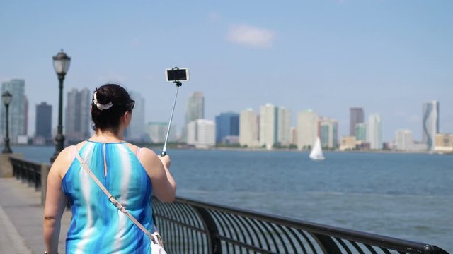 Girl Takes A Selfie on Manhattan in New York City in 4K Slow motion 60fps