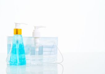 Alcohol gel and Medical face masks, Surgical mask for virus protection on white